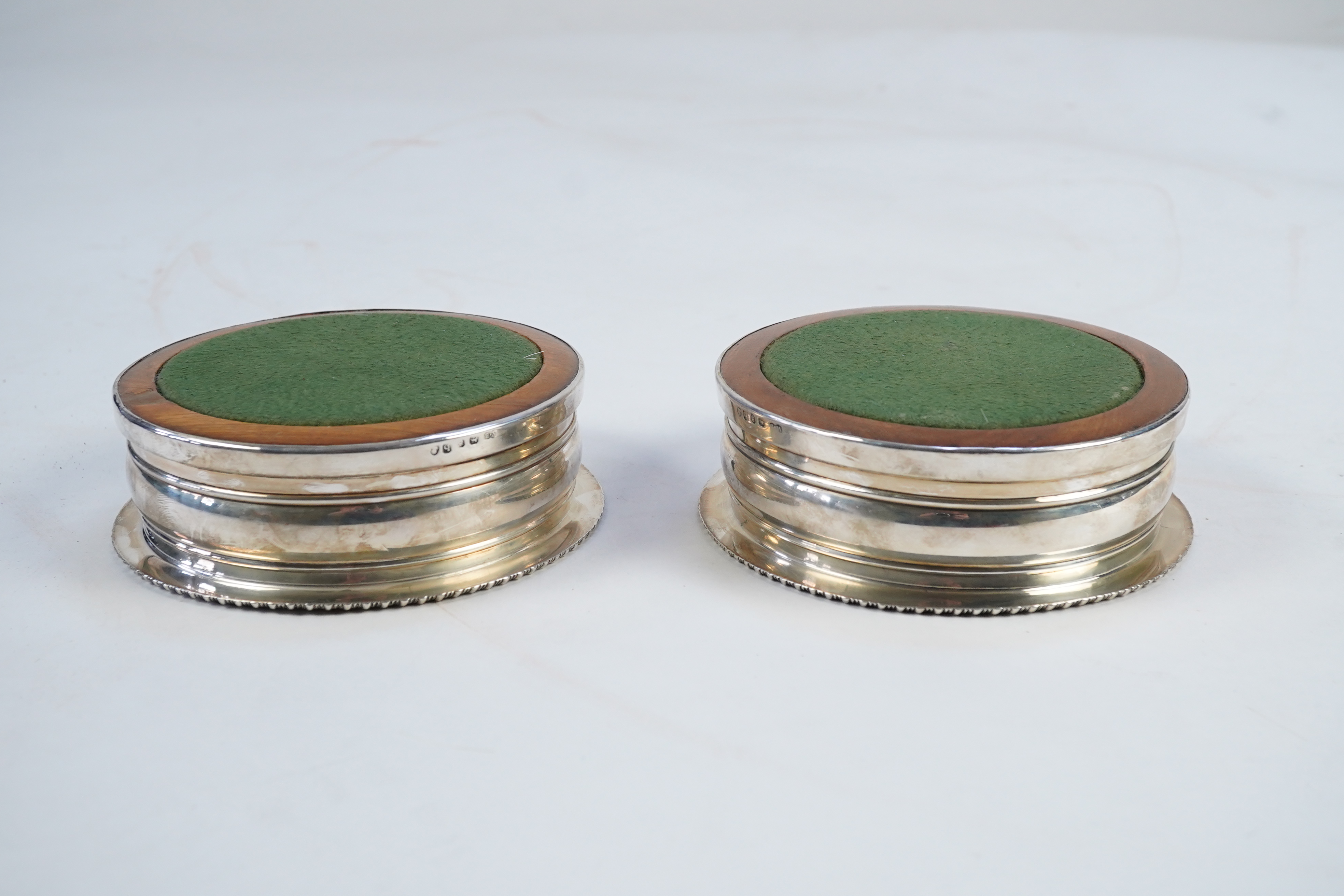 A pair of late George III silver wine coasters, by William Bateman